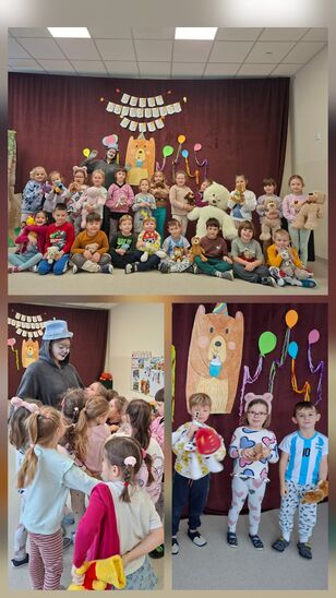 dzieci podczas zabawy na sali gimnastycznej w towarzystwie postaci w stroju misia.